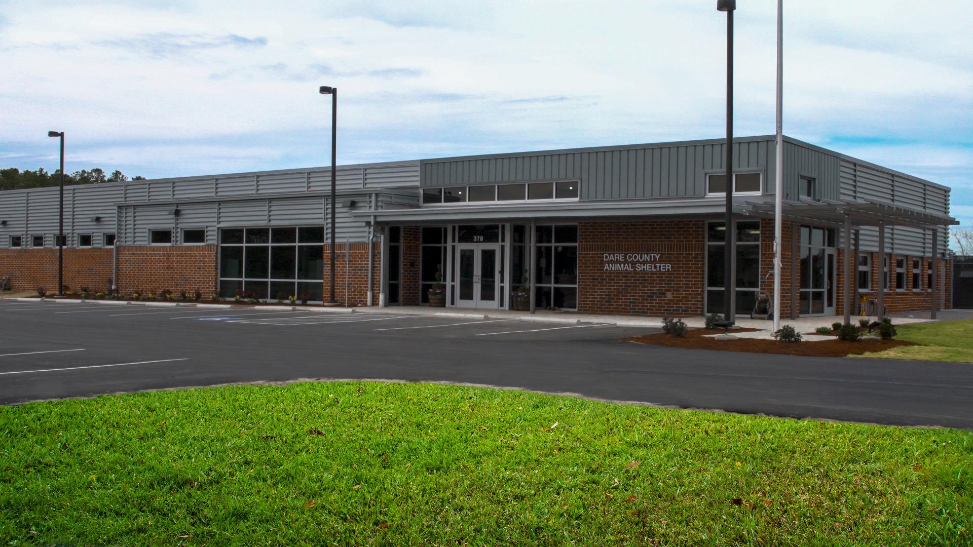 Photo of the new brick Dare County Animal Shelter building and surrounding area