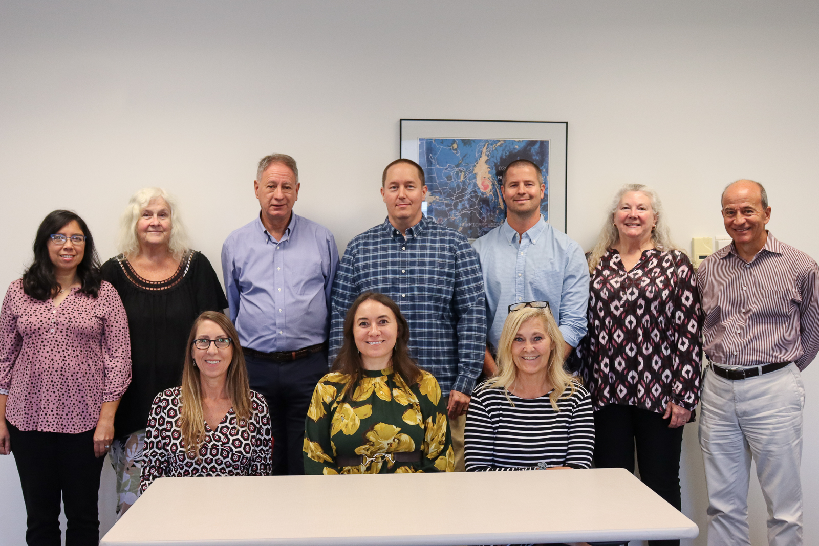 Dare County Finance Department employees, listed from left to right. Standing: Janet Midgette, Carol Saunders, David Clawson, Matt Dobrosky, Dustin Peele, Cathie Porter and Ernie Dabiero. Seated: Sally DeFosse, Anna Gallop and Amy Daniels.