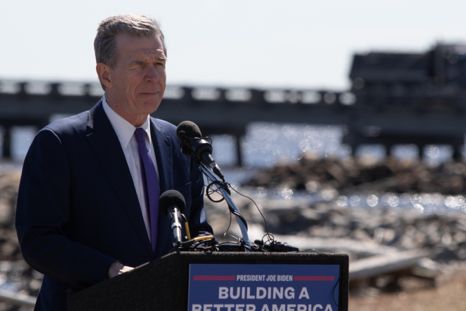 Governor Cooper speaking at a podium