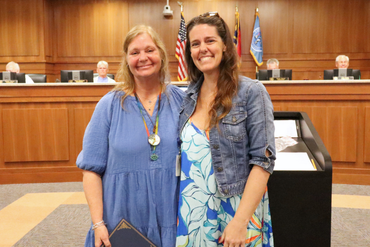 Image of Ginny Flowers receiving her certificate from Shannon Glaser.