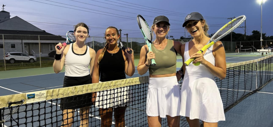 Four OBXTA women's league players stand together on a tennis court.