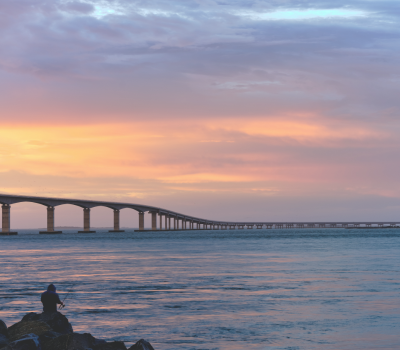 Image of the Bonner Bridge over Oregon Inlet at sunset.