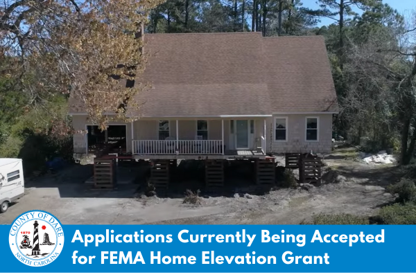 Image of a home being elevated above base flood level in Dare County